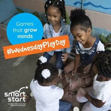 Children taking turns guessing an object in the I Spy game.