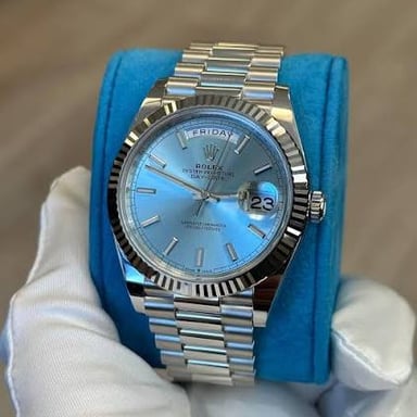 A Rolex wristwatch with a metal Oyster-style case and bracelet.