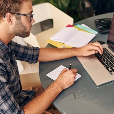 A person beginning work at a desk.