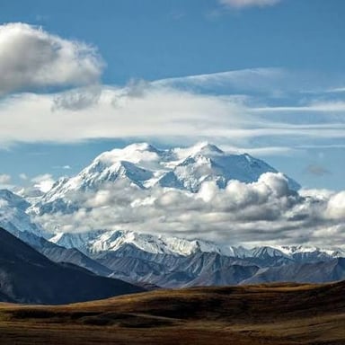 Mountain peaks representing Denali and Mount Whitney.
