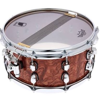 A snare drum in a drum kit, with its distinctive wires visible beneath the drumhead.