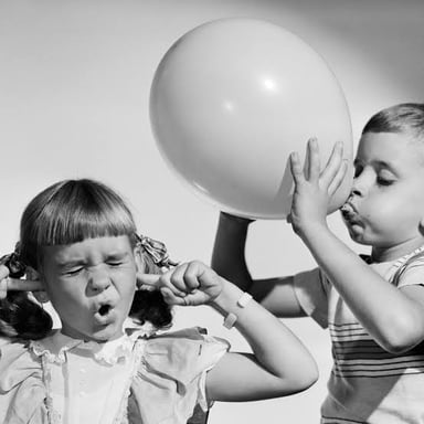 A person reacting with irritation to an interruption.