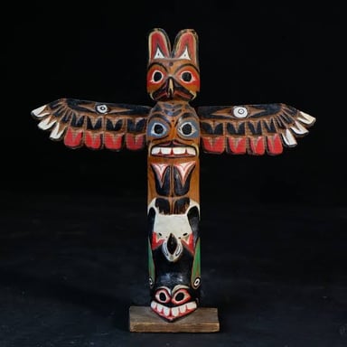 A carved totem pole, an artwork associated with some Indigenous traditions of the Northwest Coast
