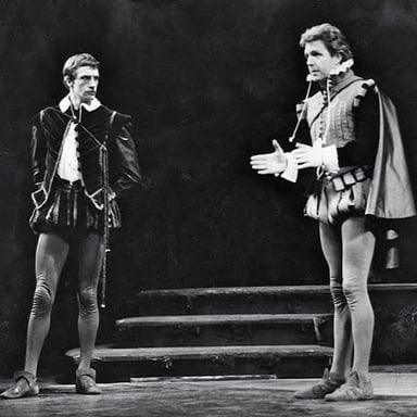 Actor in period costume delivering a dramatic Shakespearean exclamation
