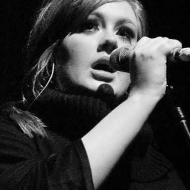 Singer Adele performing onstage.