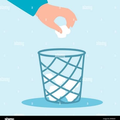 A hand throwing away a piece of paper.