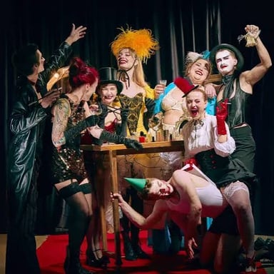 An enthusiastic theater fan surrounded by stage materials.