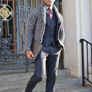 A person putting on formal clothing