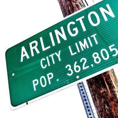 A city sign showing the place name Arlington, which ends in -ton.