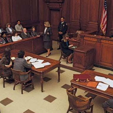 Jurors seated together in a courtroom.
