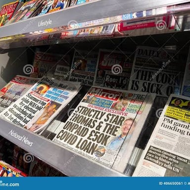 A magazine displayed among other publications at a newsstand.