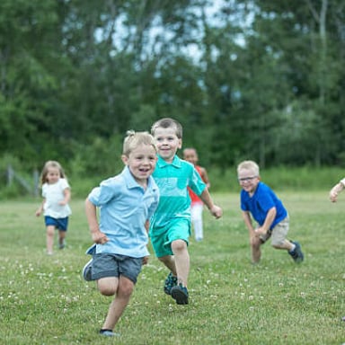 Children running while playing a game of tag