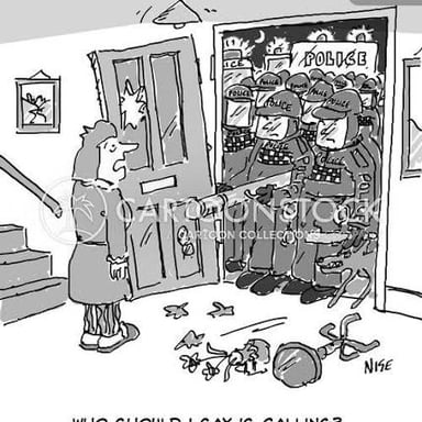 Law-enforcement officers conducting a raid in a warehouse