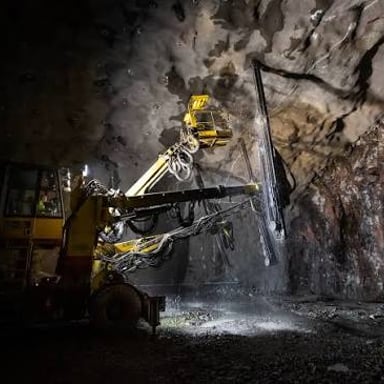 A tunnel boring machine cutting through rock.