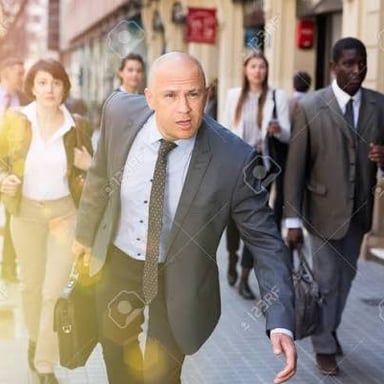 A person hurrying along a street.
