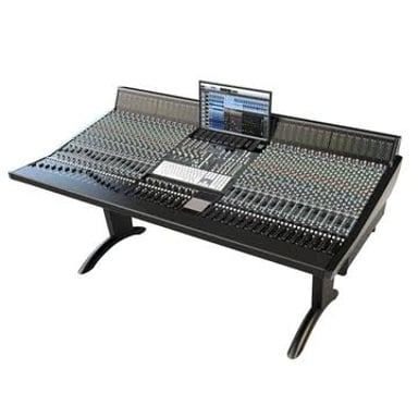 A recording studio containing a mixing console and microphones.
