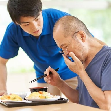 A person eating food at a meal