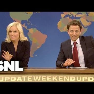 Seth Meyers and Amy Poehler presenting Weekend Update on Saturday Night Live