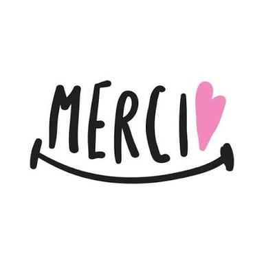 A sign displaying the French word merci, meaning thank you.