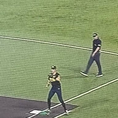 A baseball runner occupying first base