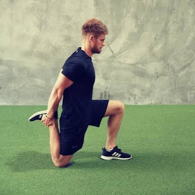 A person stretching after exercise, illustrating muscle soreness.