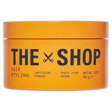 A container of pomade used for styling hair