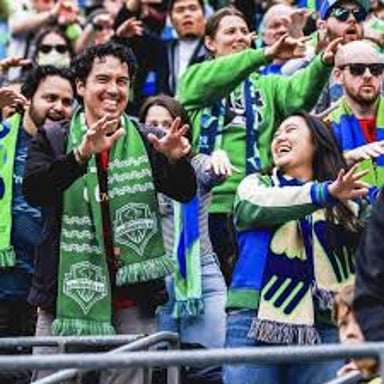 Seattle Sounders FC players competing in a soccer match.