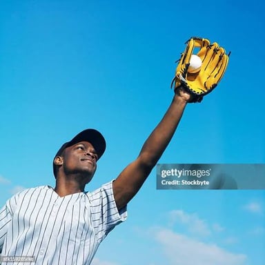 A baseball player wearing a fielding mitt
