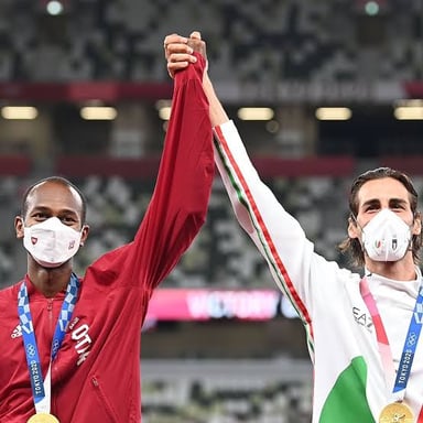 Two athletes celebrating a shared championship victory.