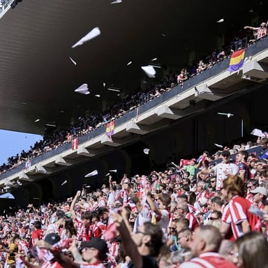Spectators calling out from the stands during a sporting event.