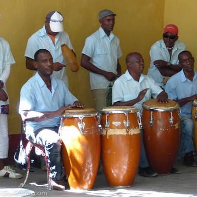 Dancers move to live percussion in an Afro-Cuban rumba performance.
