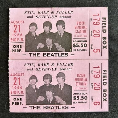 A used concert ticket stub, the kind of paper keepsake that might be discarded after a show.