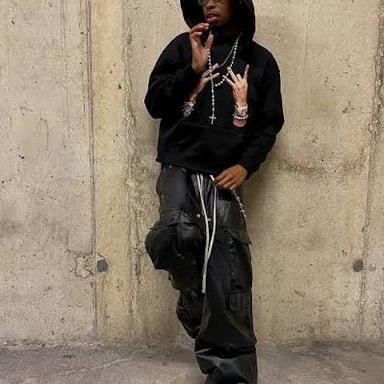 Casual streetwear pieces such as a graphic T-shirt, hoodie, and sneakers.