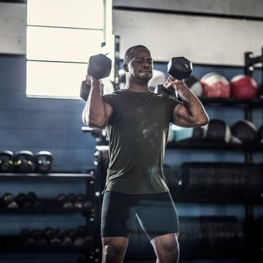 A person exercising with dumbbells.