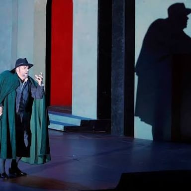 Portrait of composer Giuseppe Verdi alongside a production image from his opera Rigoletto.