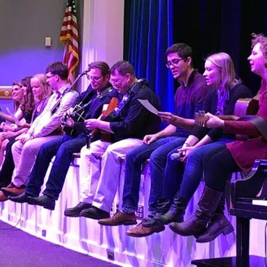 Performers returning to the stage to give an encore.