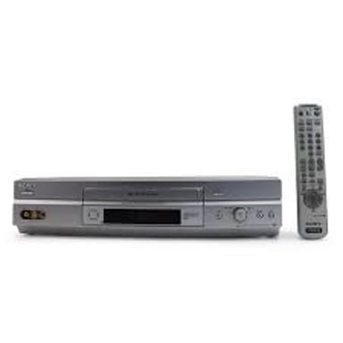 A home VCR beside a VHS videocassette, the kind of device once used to play video-store rentals.