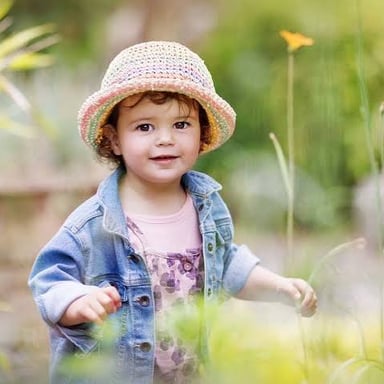 A young child outdoors.