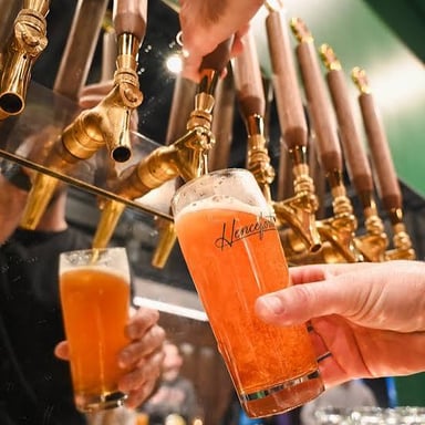 A bar with taps serving craft beer.
