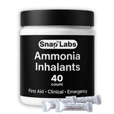 A small bottle of smelling salts, a pungent ammonia-based inhalant.