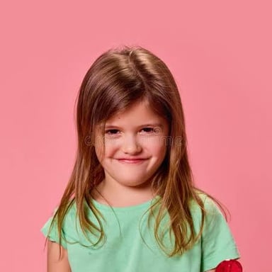 A mischievous child with an impudent expression