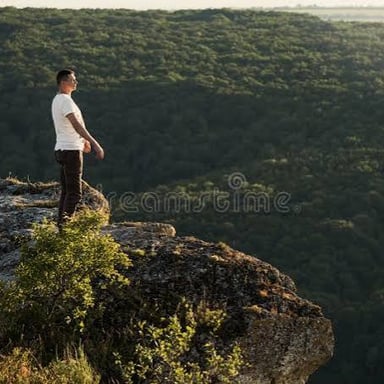 A person gazing at a dramatic mountain view in amazement