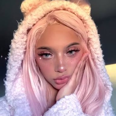 A young person displaying makeup and fashion associated with the e-girl aesthetic.