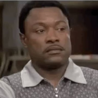 A person making a skeptical facial expression during a conversation