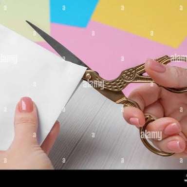 Scissors making a short cut through a piece of paper.