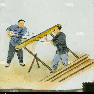 A worker performing a physically demanding manual task.