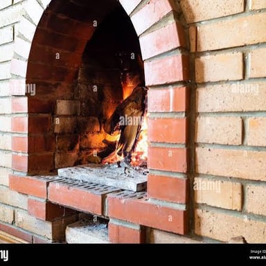 A brick hearth at the base of a fireplace.