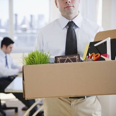 An employee receiving news of dismissal at an office