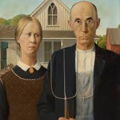Grant Wood’s American Gothic, showing two figures before a white house with a pointed window.
