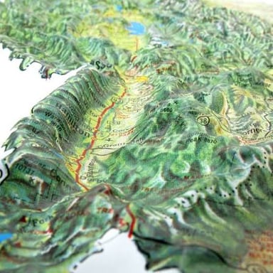 A three-dimensional relief map with raised mountain ranges and valleys.